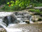 Visitors come on hot days to swim in the cool waters of Travertine Creek.