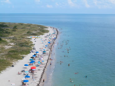 Florida residents and visitors enjoy 1.25 miles of natural beach at Cape Florida State Park.
