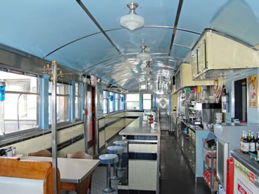 Classic Looking Large Diner. Blue Stools and Off-White Countertop