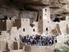 People enjoy a tour of Mesa Verde National Park.