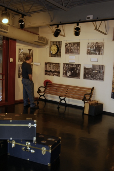 A visitor examines the newest exhibit images and text on display at Steamtown NHS.