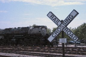 Photo of railroad crossbucks.  The white X with