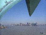 The statue's ray float above the city