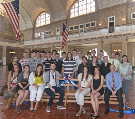 Students from Campbell-Savona High Schools take a seat in history as they presented two new benches to Ellis Island as part of a NPS Distance Learning program.