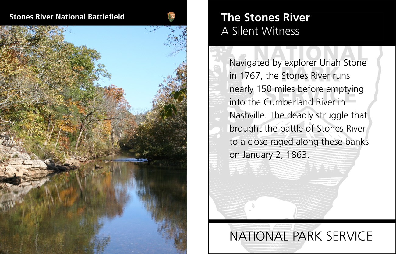A still river with rocks along the bank and trees covering both banks. Text of the reverse side is shown.