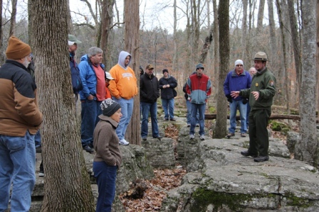 A park ranger talks to visitors in the Slaughter Pen.