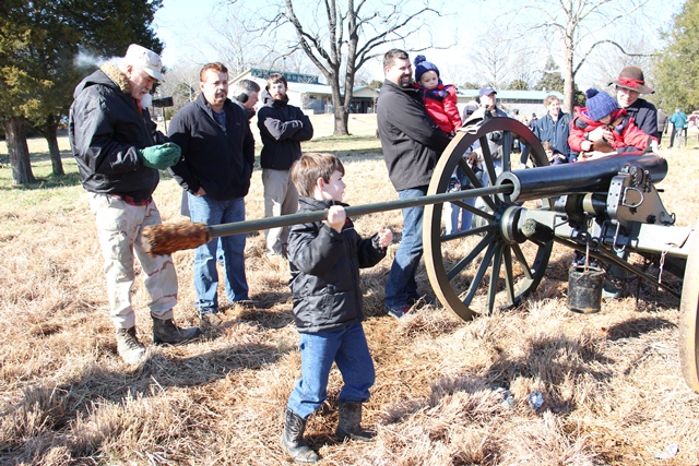 Young visitors try their hand at cannon drill.