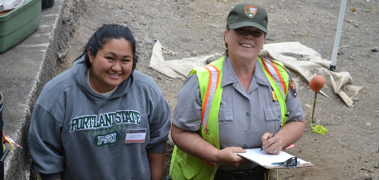 Student and NPS Archeologist
