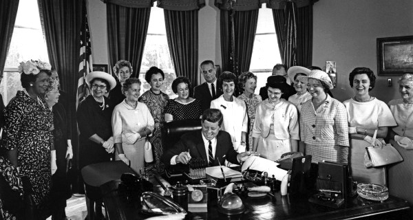 President John F. Kennedy signing the Equal Pay Act in the Oval Office, 1963 President John F. Kennedy signing the Equal Pay Act in the Oval Office, 1963