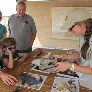 Ranger showing fossils to park visitors