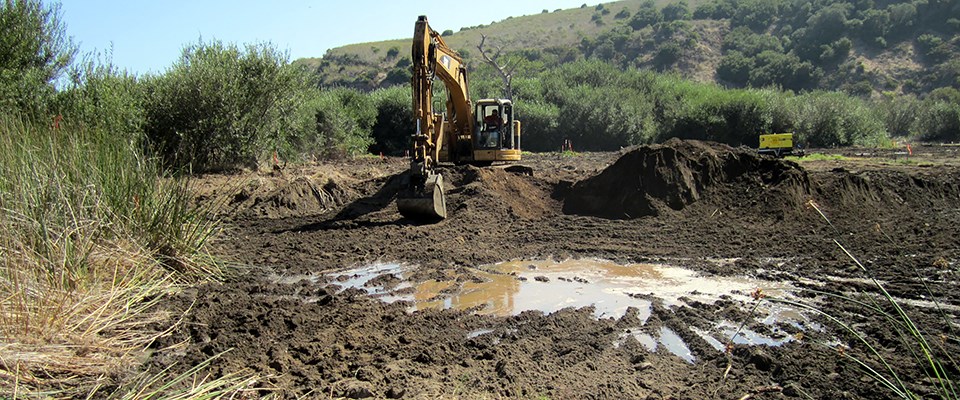 Excavating fill material to restore a buried coastal wetland at Prisoners Harbor, Channel Islands National Park, California