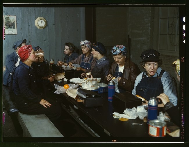 Women workers employed as wipers in the roundhouse having lunch, C. & N.W. R.R., Clinton, Iowa. Library of Congress, https://www.loc.gov/item/2017878365/