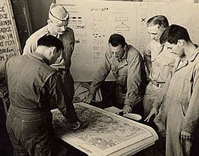 OSS intelligence reviewed existing maps with the military.
