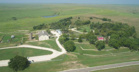 View the ranch headquarters area from above the tree line.