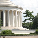 close up of the columns and green shurbs of the memorial