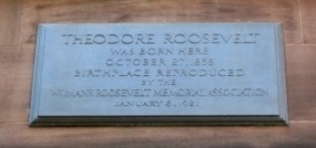 A plaque over the entrance to Theodore Roosevelt Birthplace. 