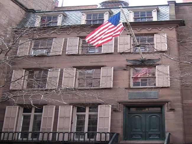 Colored photograph of Birthplace exterior