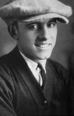 Black and white portrait of Wayne Hansen wearing cap.