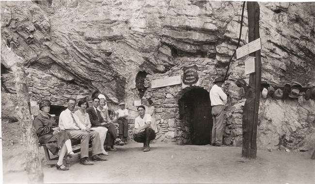 Historic photograph of people waiting for a tour outside Timpanogos Cave.