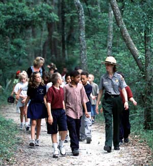 Ranger leading kids on a hike