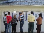 Students reading Shackles of Memory exhibit.