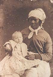 Historic photograph of an unnamed slave woman holding a white child