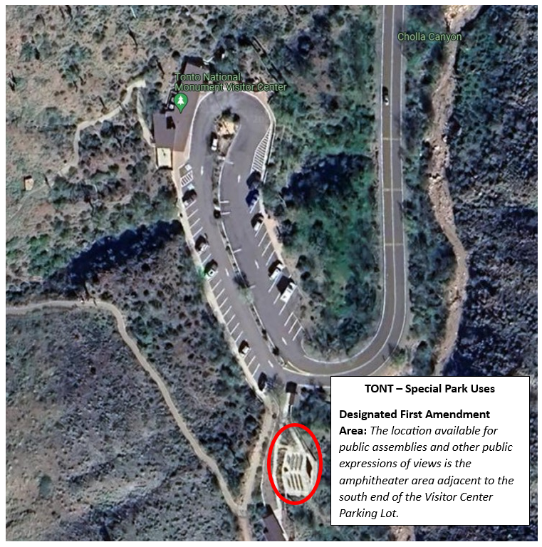 Aerial view of parking lot with the amphitheater circled in red.