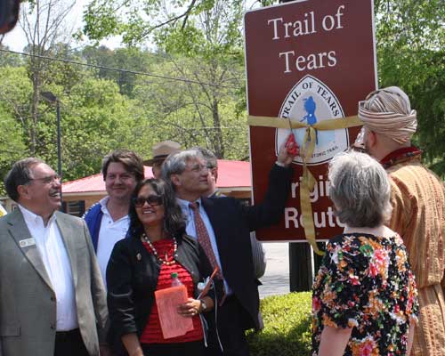 Cherokee Chief Dan Smith performs the ribbon cutting at an Original Route signage unveiling on the Trail of Tears National Historic Trail.