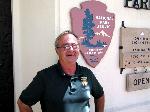 Volunteer Marv Leanna in front of Visitor Center