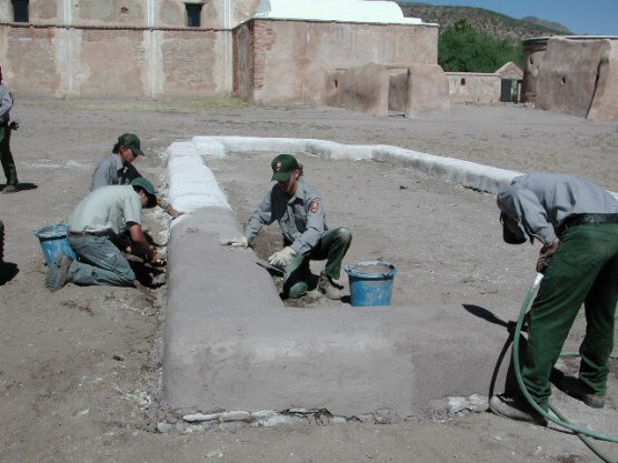 nps preservation workers building and applying lime plaster to jesuit church foundation