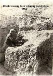 Excavating Tuzigoot - worker with brush