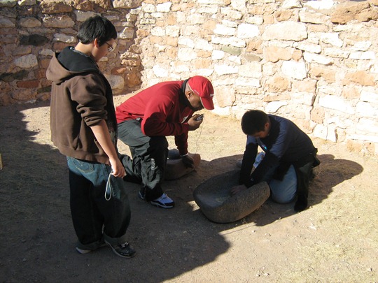 OMK Teamwork Group records audio while grinding corn