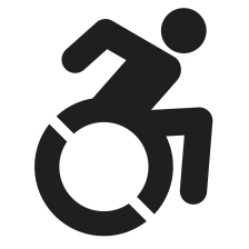 black and white image of a person using a wheelchair