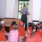 Critter Campers learn about the historic home from a ranger