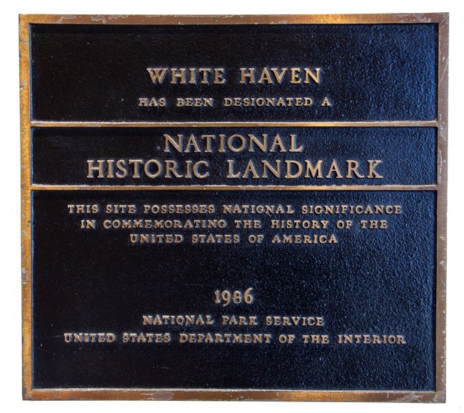 Photograph of a bronze plaque designating White Haven and a National Historic Landmark