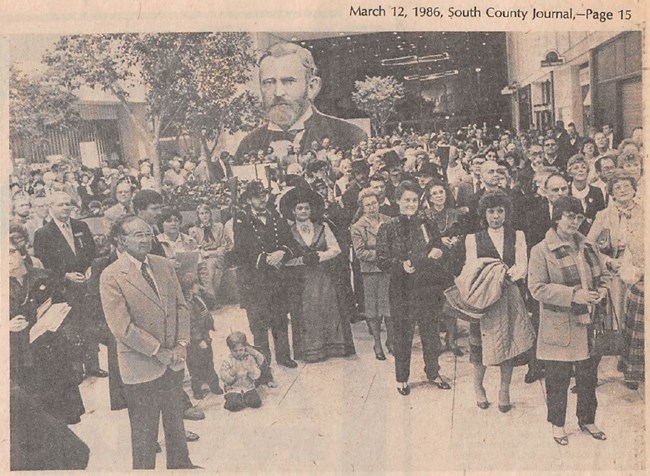 Black and white photograph of a large crowd of people in Crestwood Mall, some dressed as Ulysses and Julia Grant