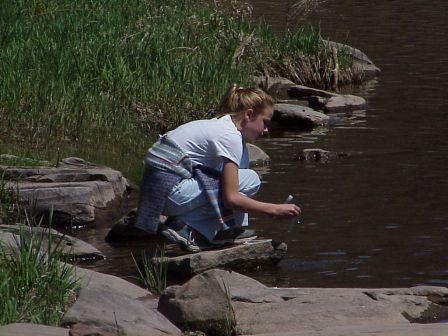Student collects water sample from the Upper Delaware River.