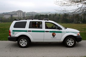 law enforcement patrol vehicle on park tour road
