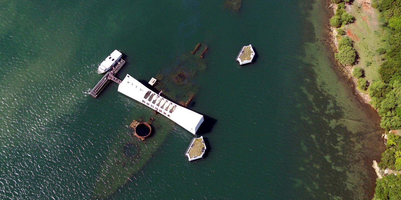 An aerial view of the USS Arizona and memorial.