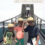 Kids work on their Junior Ranger booklets at the USS Arizona Memorial.