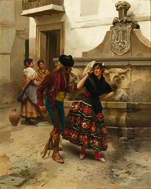 A brightly dressed Spanish couple in a courtyard.