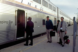 Trails and Rails volunteers and Amtrak employees board train