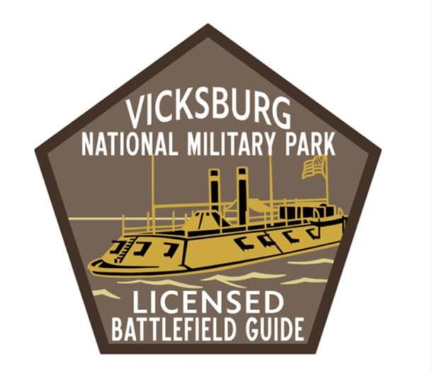 A pentagon with Vicksburg Licensed Battlefield Guide written inside of it.