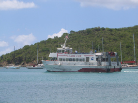 Ferry leaving St. John for St. Thomas with tour group aboard.