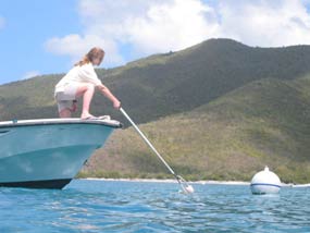 NPS employee performs maintenance to a non-commercial use mooring.