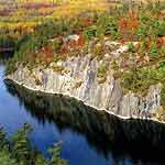 Granite cliffs tower over the waters of Grassy Bay