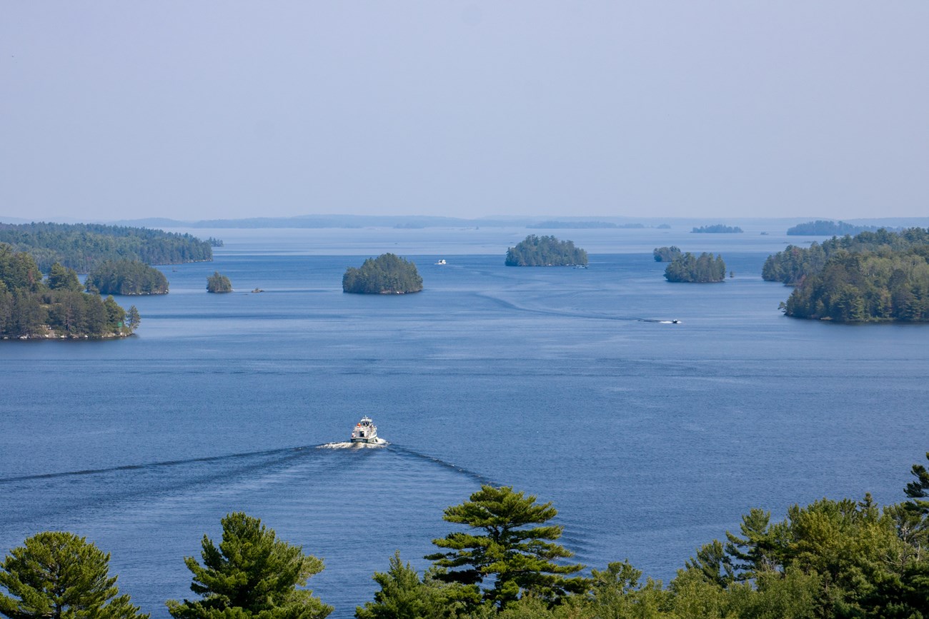 The Voyageur tour boat can be seen traveling into a vast expanse of lakes and islands