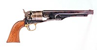 A colt revolver with a metal barrel and wooden handle.