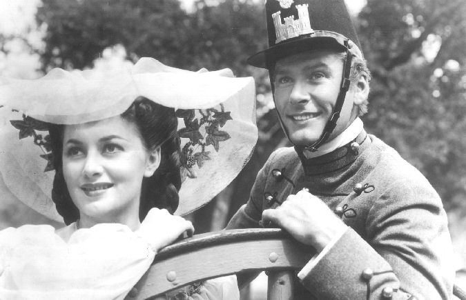 Errol Flynn and Olivia de Havilland in the film being shown at Washita's Movies in the Park.