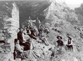 Group of people dressed in their Sunday best at a cliff dwelling